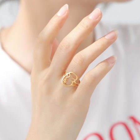 Bague Femme Visage Abstrait Acier Doré